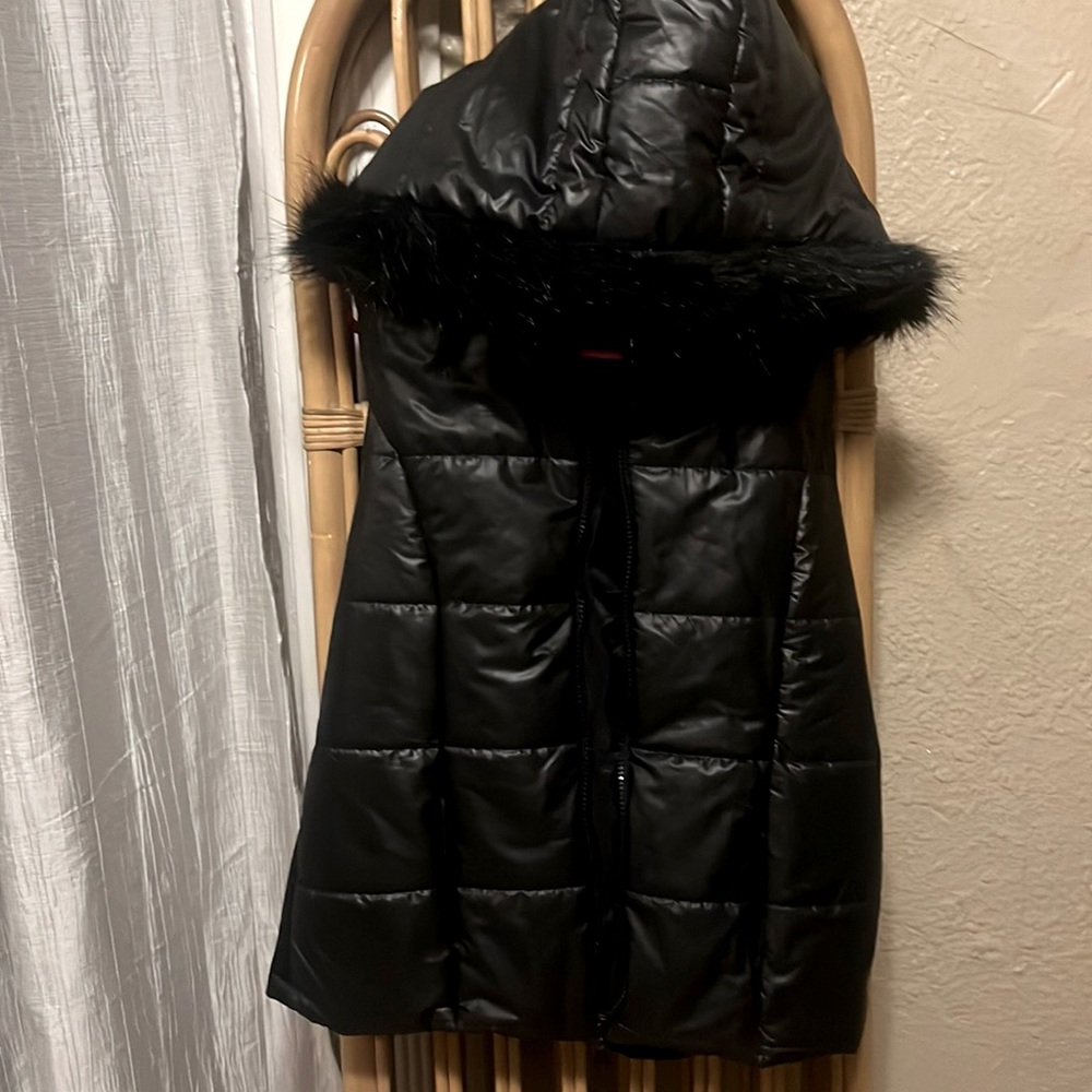 Black puffer zip up vest BRAND NEW with a fur hoody in mint condition .